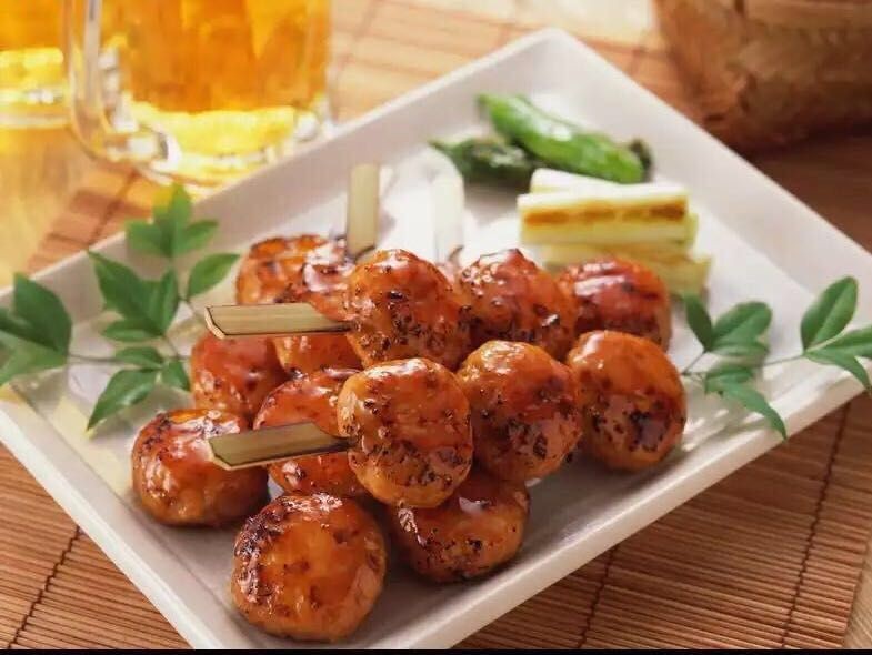 Grilled chicken balls on skewers