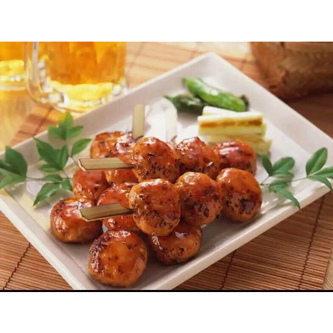 Grilled chicken balls on skewers