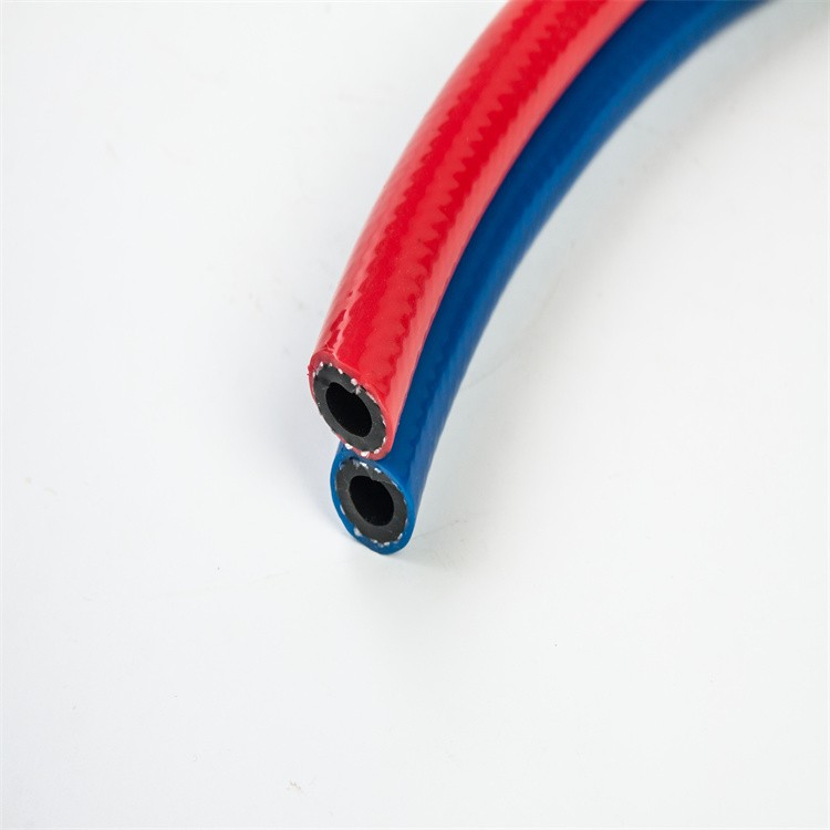 Two pipes welded red and blue double air hose high pressure spray hose